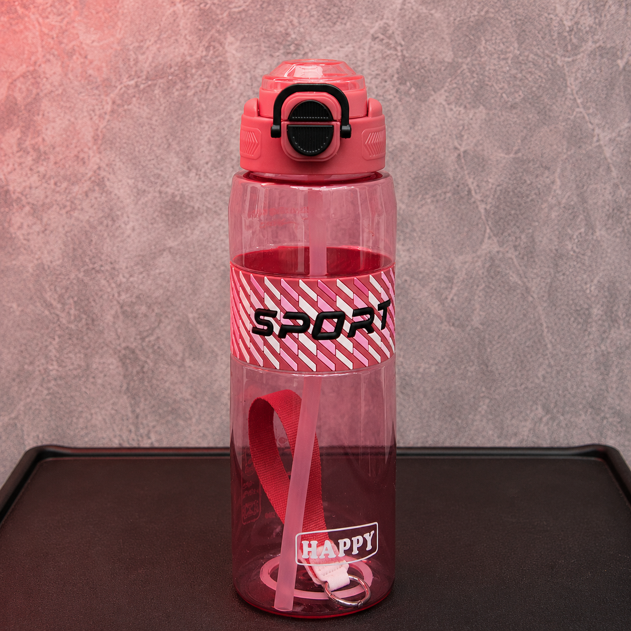 Pink sports water bottle with built-in straw, locking flip lid and carry strap for school, sports and daily hydration.