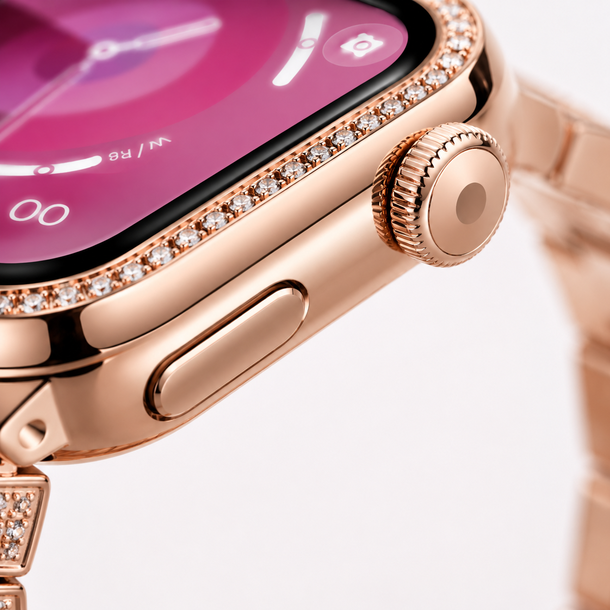 Close-up of the precision rotating crown, side button and crystal-studded bezel on the rose gold smartwatch.