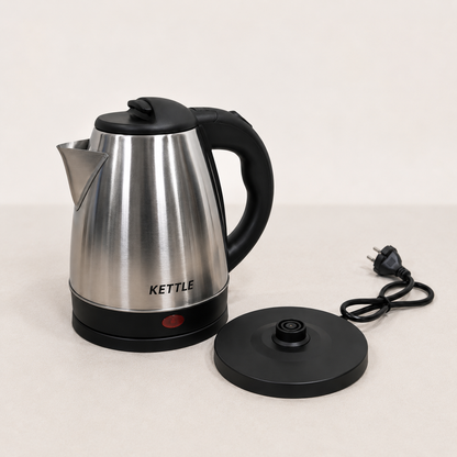 Stainless Steel Electric Kettle with cordless swivel base and indicator light, premium brushed metal finish, isolated on clean white background.
