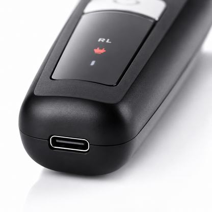 Close-up macro image of the Rock Light RL-TM9200 Professional Hair Trimmer featuring a USB Type-C charging port, matte black body, LED charging indicator, and premium textured finish
