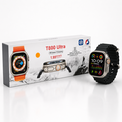 Ultra-style 49mm smartwatch with a space gray aluminium case and black silicone strap displayed beside its retail packaging on a clean white background. Features a large edge-to-edge display, orange-accent digital crown, side action button, wireless charging support and premium modern design.