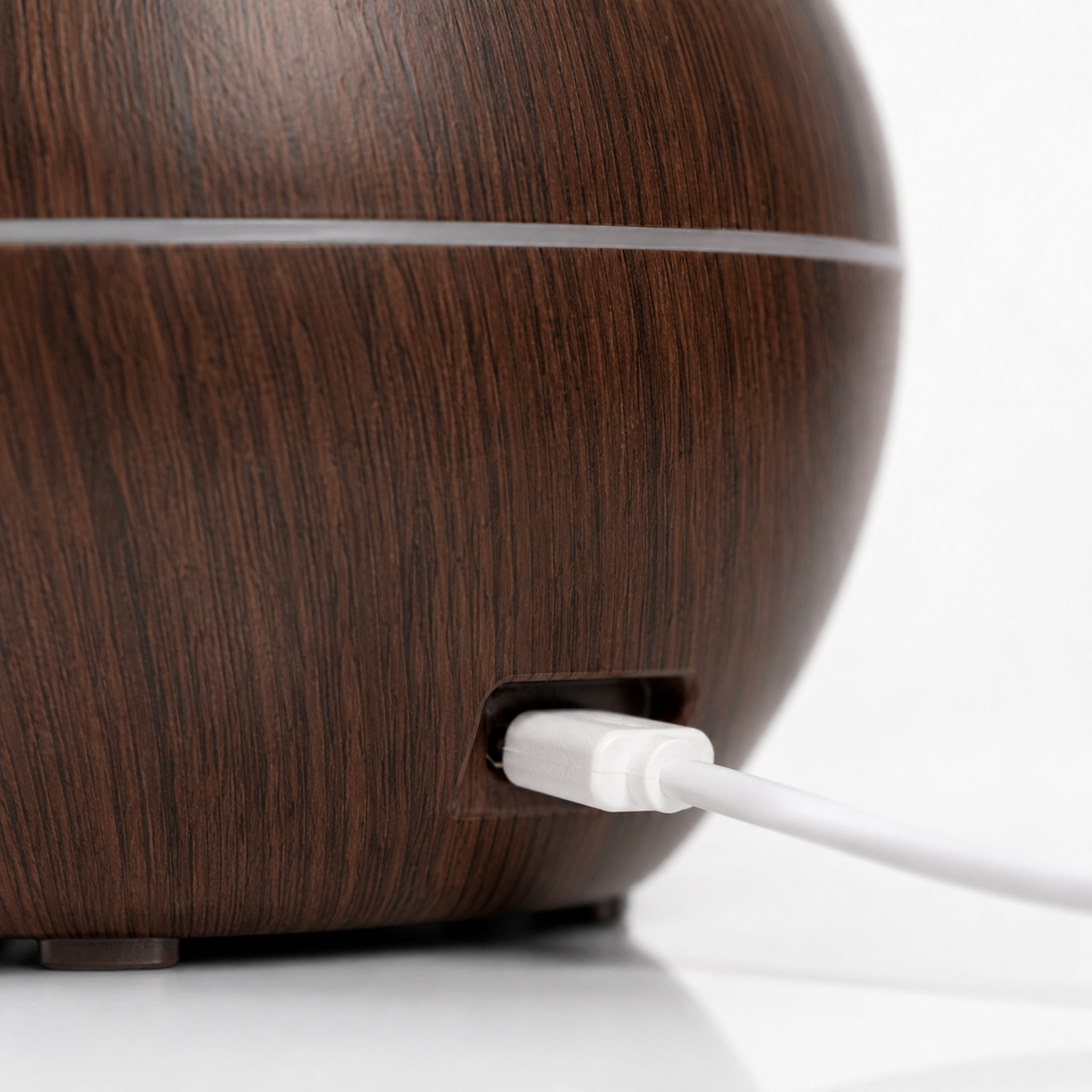 Close-up of the USB charging port on a wood-grain ultrasonic aroma humidifier, highlighting the DC 5V USB-powered connection for convenient everyday use.