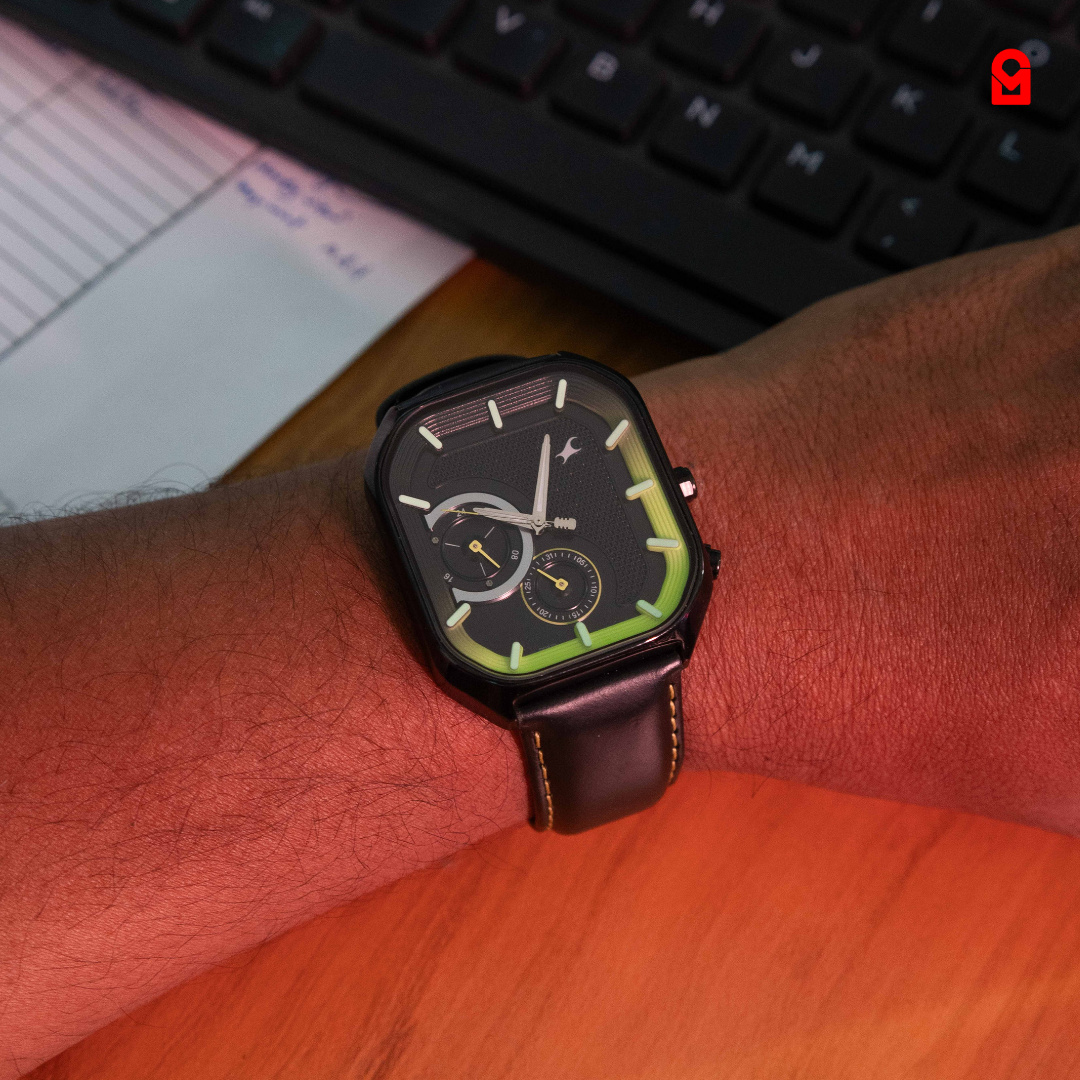 Vector Black Edition Watch on wrist black square sport watch with neon green accents and leather strap.