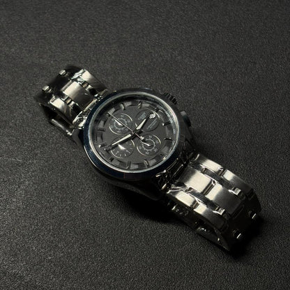Replica chronograph watch with silver and silver stainless steel bracelet, silver multi-dial analog display, luxury men's fashion wristwatch on silver textured background