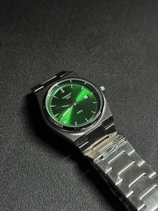 Replica watch with green sunburst dial, stainless steel integrated bracelet, date display window and luxury sports watch design on black textured background