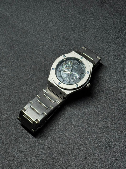 Premium black skeleton dial replica watch featuring stainless steel strap, open-work display and luxury-inspired wristwatch styling.