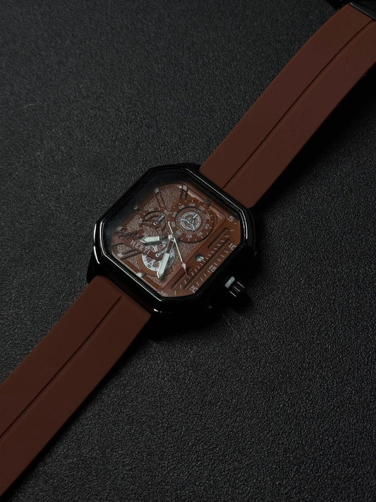 Brown silicone strap replica watch close-up showing square black case, textured skeleton dial, and premium fashion timepiece details.