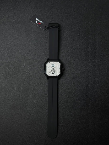Black silicone strap replica watch featuring square black case, white skeleton dial, and modern luxury-inspired design.
