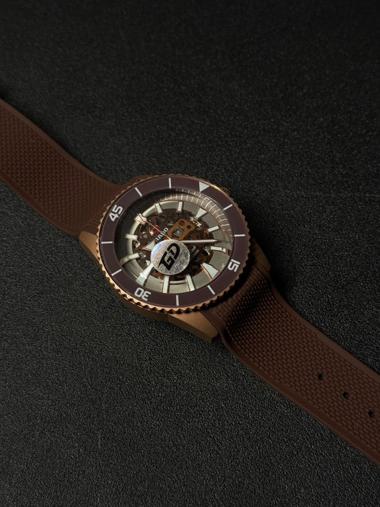 Brown luxury replica watch featuring a skeleton dial, textured rubber strap, and premium sport-style bezel in close-up view.