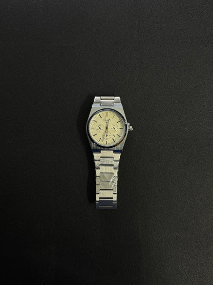 Silver stainless steel replica watch featuring a textured white dial, integrated bracelet and elegant minimalist luxury design.