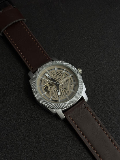 Premium replica watch with skeleton dial, silver textured bezel, brown leather strap, luxury-inspired men's analog wristwatch close-up
