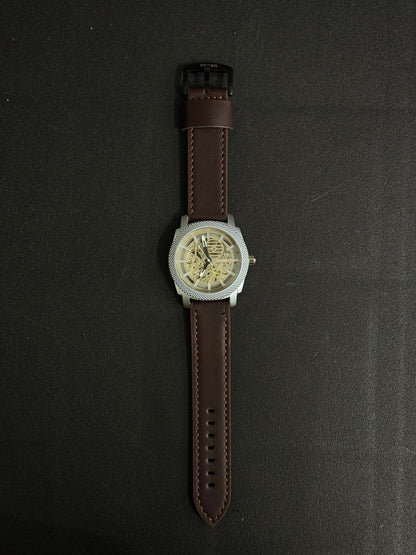 Premium replica watch with skeleton dial, silver textured bezel, brown leather strap, luxury-inspired men's analog wristwatch close-up