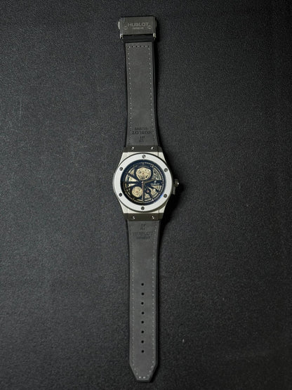 Replica watch with skeleton mechanical style dial, grey leather strap, elegant luxury design, full length product photography