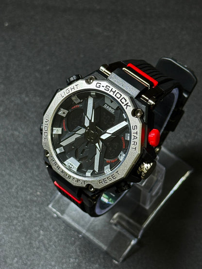 Premium replica sports watch with silver bezel, black dial, red accent buttons, analog digital display and durable black strap close-up view