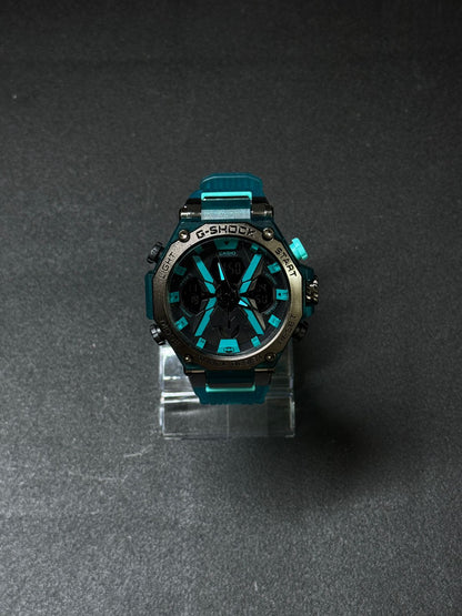 Teal blue replica G-Shock style watch with analog digital display, rugged outdoor sports design, black dial and silicone strap