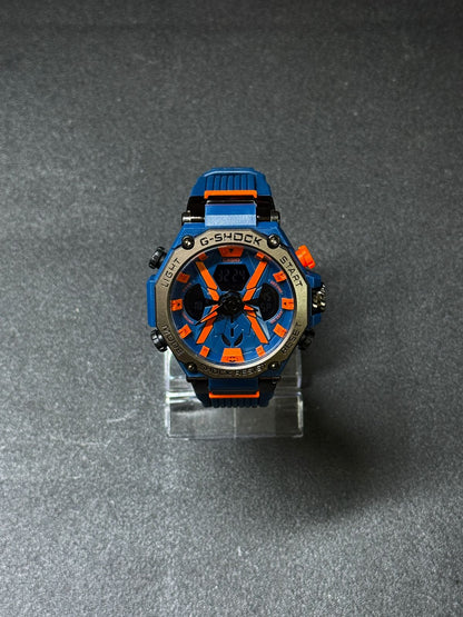 Blue and orange replica G-Shock style sports watch with dual display, oversized rugged dial, silicone strap and outdoor-inspired design
