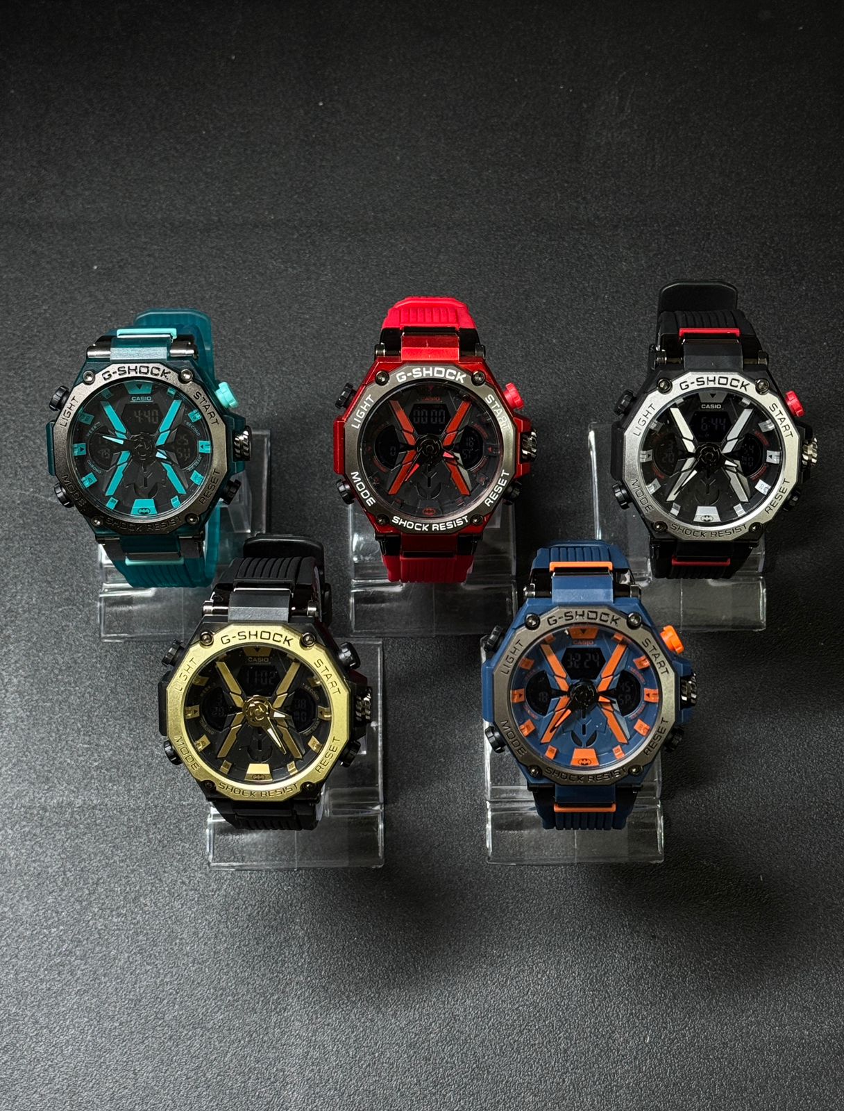 Replica sports watch collection featuring teal, red, black gold, black silver and blue orange color variants with analog digital display