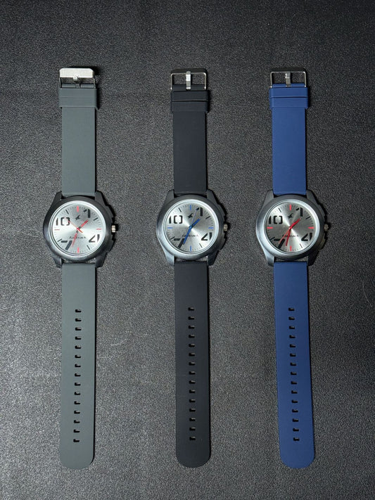 Replica Watch collection with grey, black and blue silicone strap options, silver sunburst dial, black case and contemporary men's analog watch design.