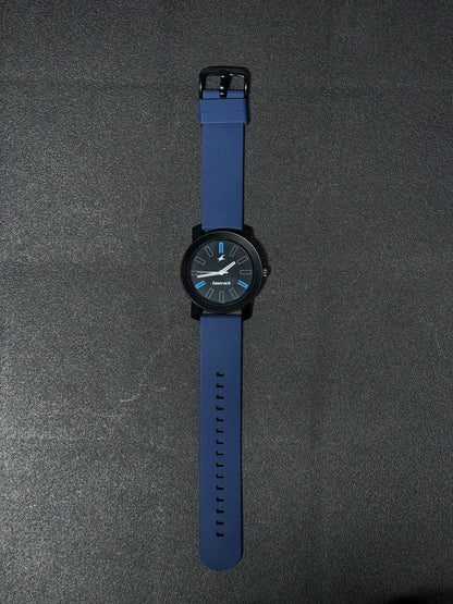 Blue silicone strap replica watch with black dial, blue accent hour markers, lightweight casual fashion wristwatch for everyday wear