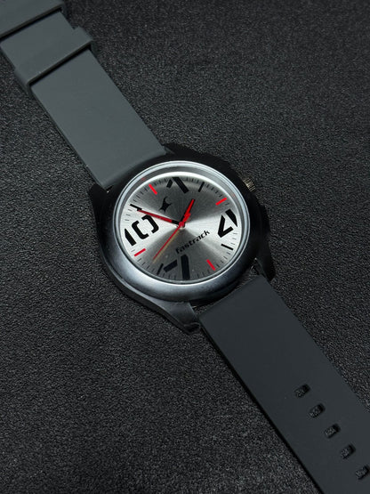 Replica Watch with grey silicone strap, silver sunburst dial, black case, red hands and modern analog display, premium men's casual wristwatch product photography.
