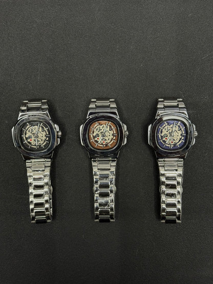 Replica watch collection featuring black, brown and blue skeleton dials with stainless steel bracelets, luxury men's wristwatch display