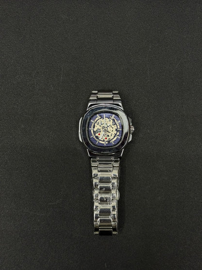 Replica watch featuring blue skeleton dial, silver-tone stainless steel strap, luxury automatic-style men's wristwatch product image