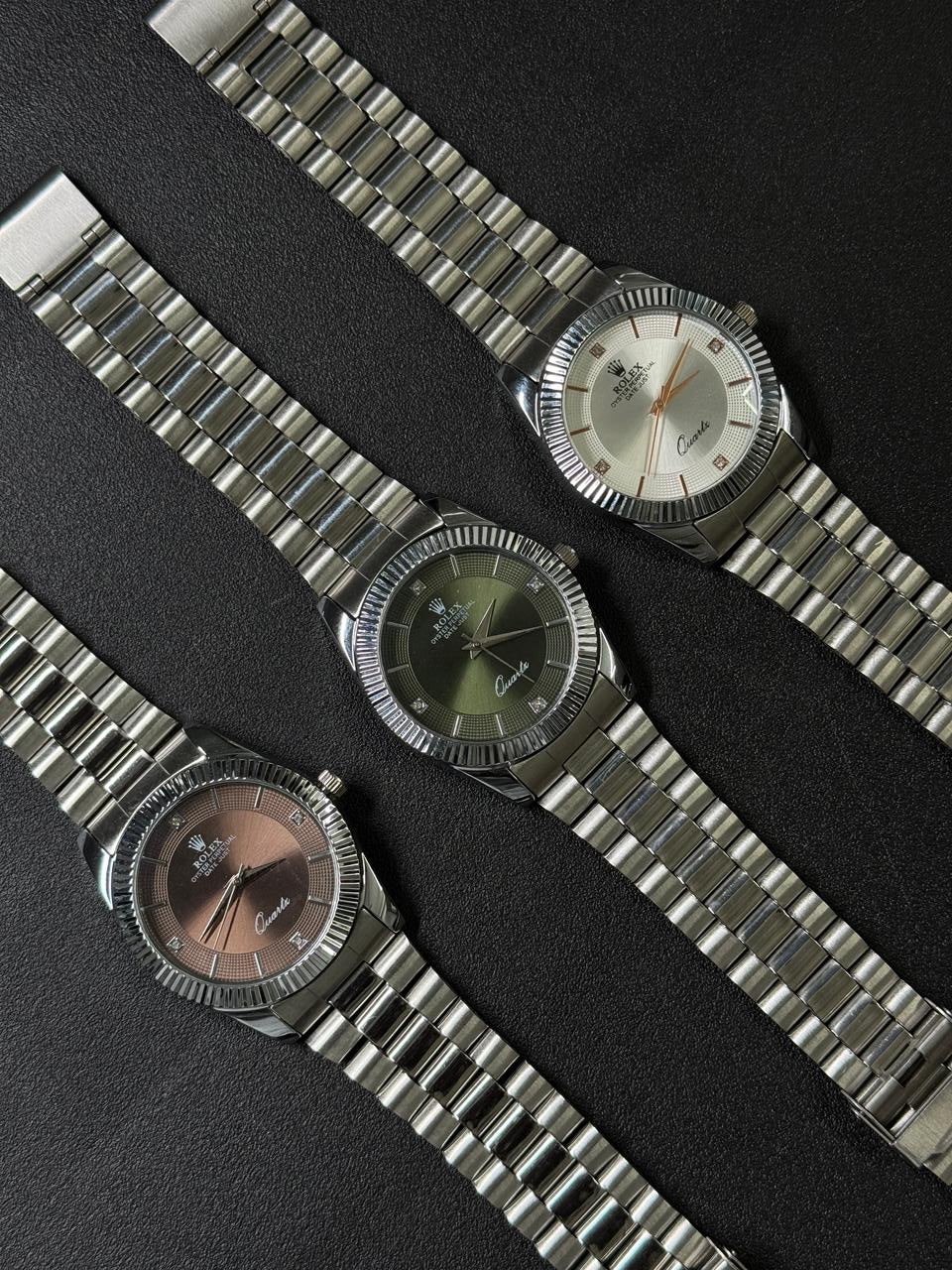 Three silver watches with metallic bracelets 
