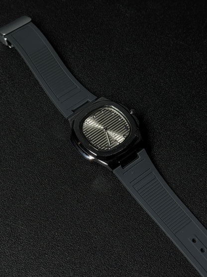 Black strap replica watch with textured dial, octagonal case design, luxury analog wristwatch and premium rubber strap on dark background