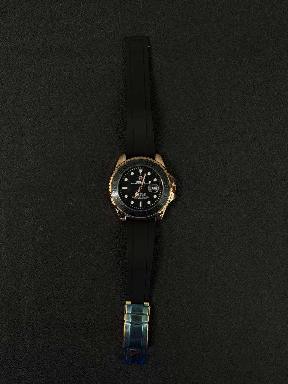 Replica sports watch with black silicone band and premium gold tone case