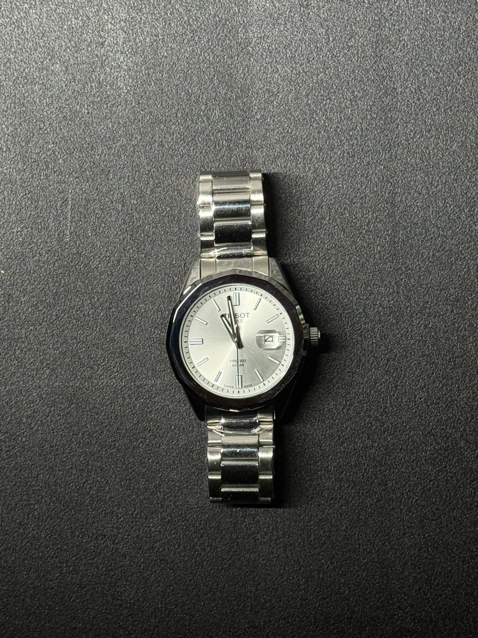 Silver dial replica watch with stainless steel band, elegant men's analog wristwatch with date display and premium finish