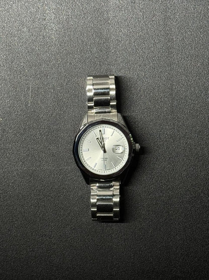 Silver dial replica watch with stainless steel band, elegant men's analog wristwatch with date display and premium finish