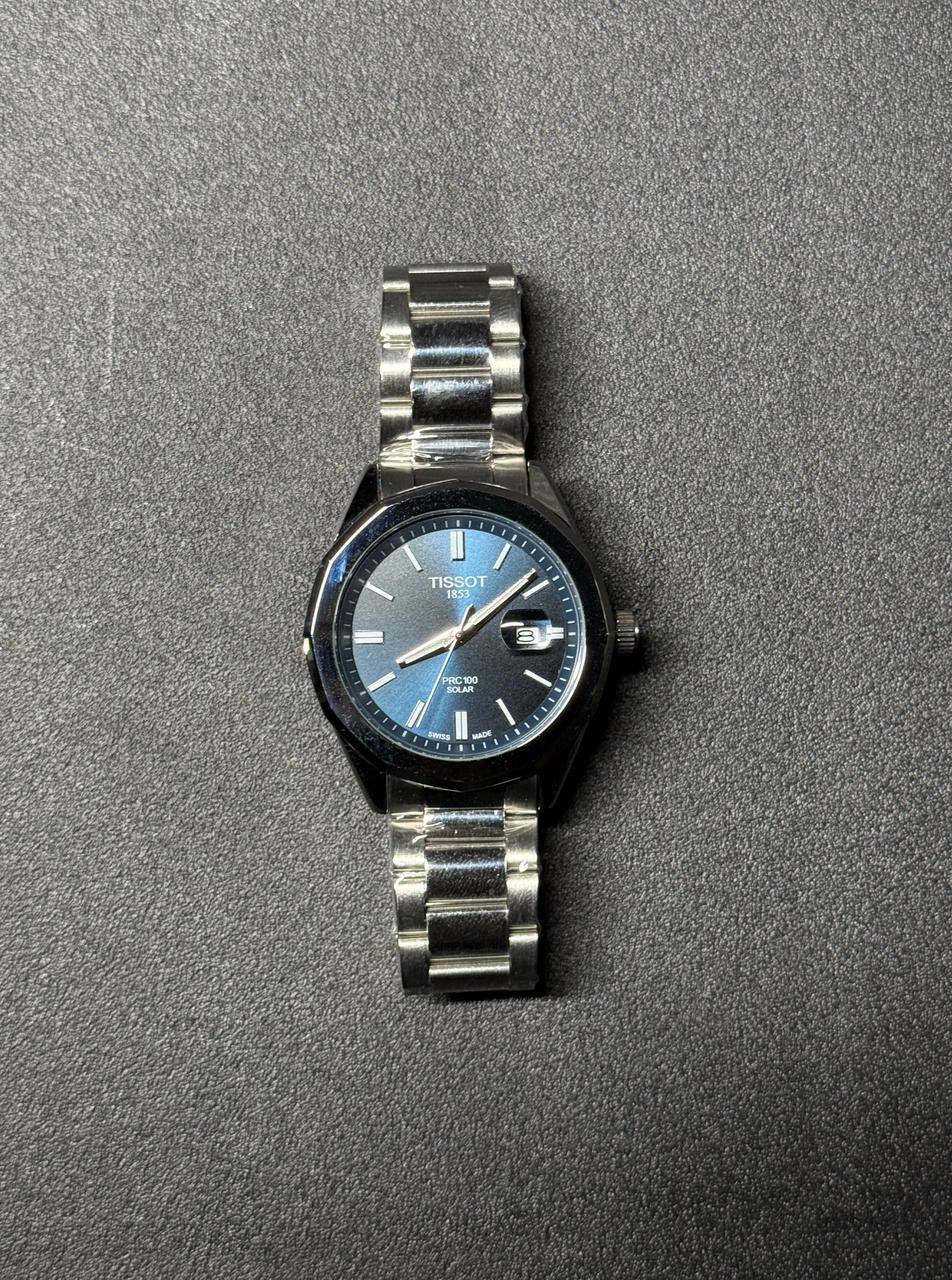Blue dial replica watch with stainless steel strap, luxury analog men's wristwatch with date display and premium metal bracelet