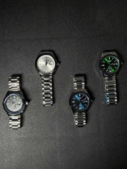 Replica watch collection featuring black, silver, blue and green dial stainless steel men's watches displayed on dark background