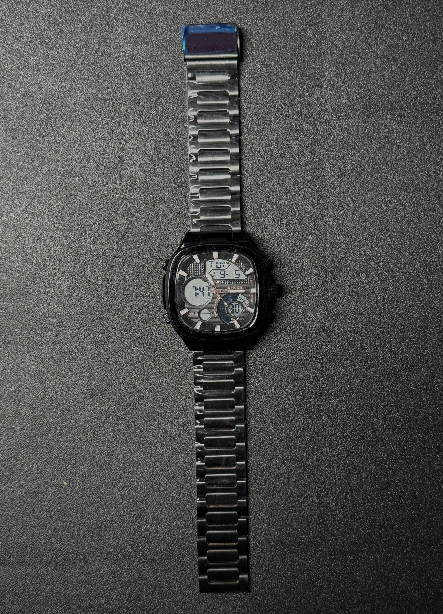 Premium black replica watch featuring analog and digital time display, stainless steel bracelet strap, modern square dial men's wristwatch product photography