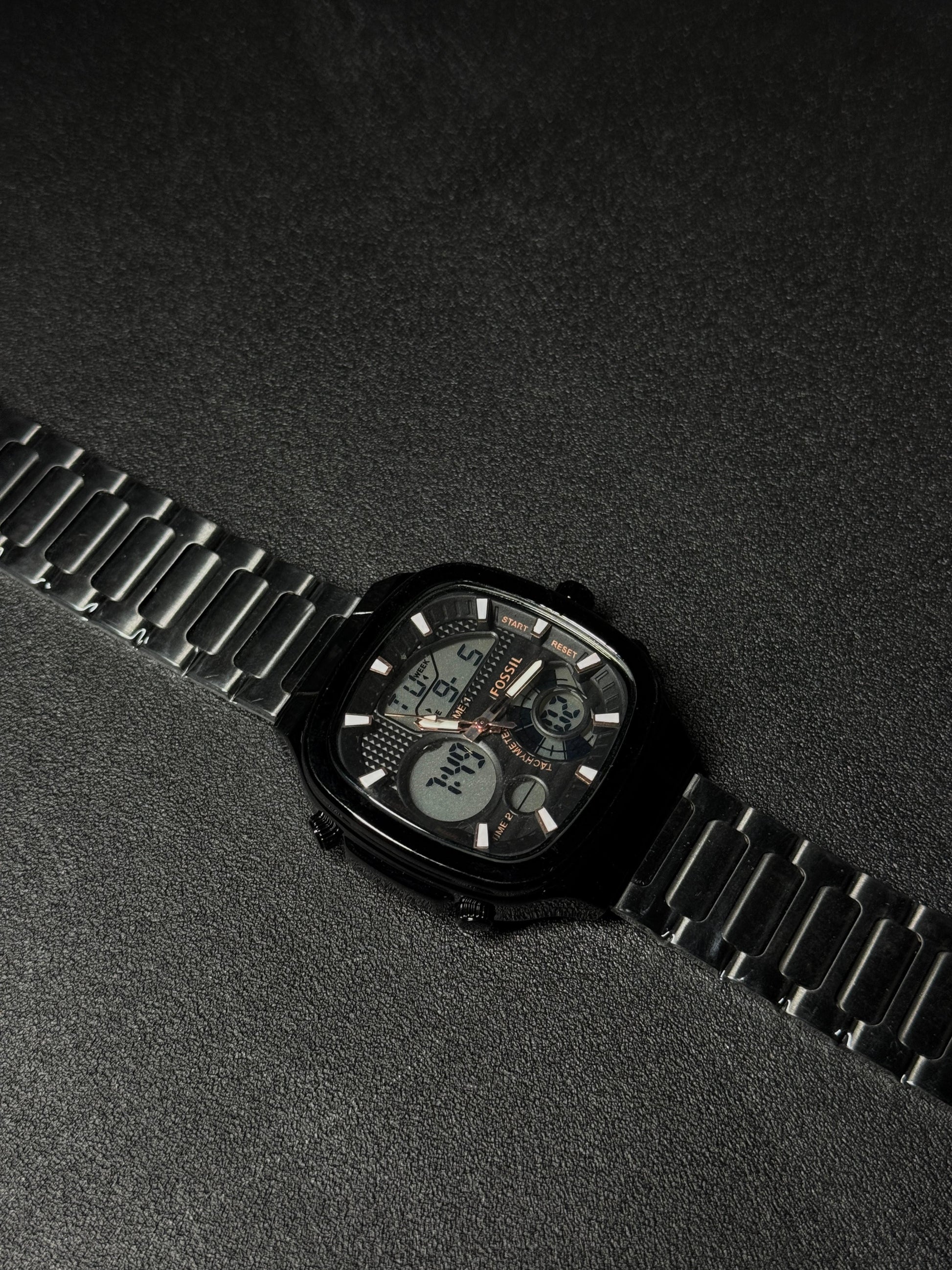 Black stainless steel replica watch with dual analog-digital display, square case design, luxury metal strap, premium men's fashion wristwatch on dark textured background