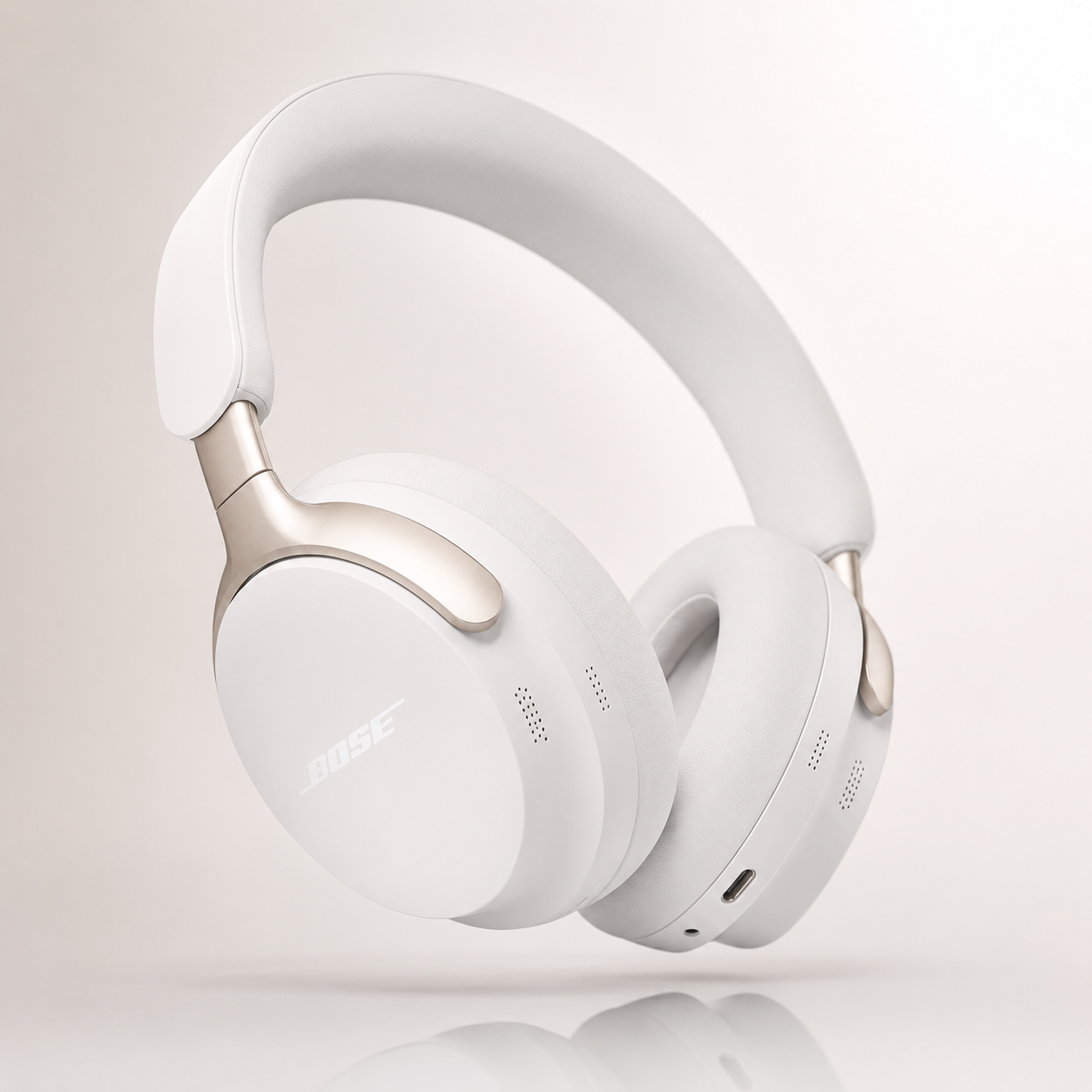 Premium white wireless over-ear Bluetooth noise cancelling headphones with soft memory foam ear cushions, adjustable padded headband, USB-C charging and elegant metallic accents