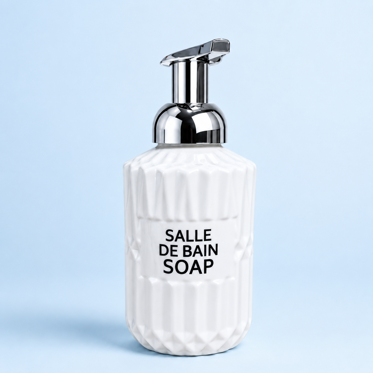 White Ribbed Soap Pump Bottle with chrome dispenser pump, textured ceramic-style body, modern bathroom countertop soap dispenser on light blue background