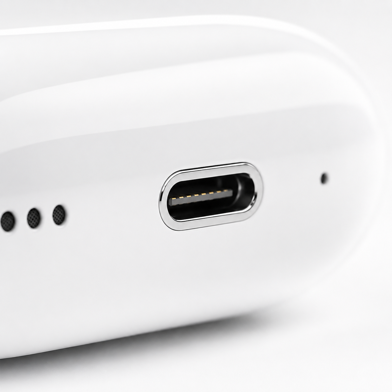 Macro close-up of USB-C fast charging port on a wireless earbuds charging case, featuring a modern design, precision finish, and convenient charging connectivity.