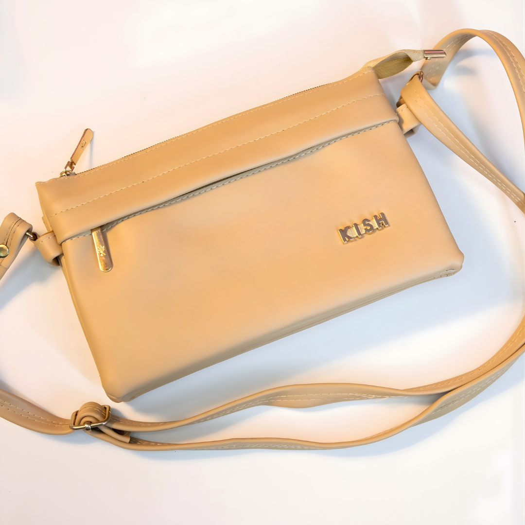 Beige zip closure crossbody sling bag with adjustable shoulder strap.