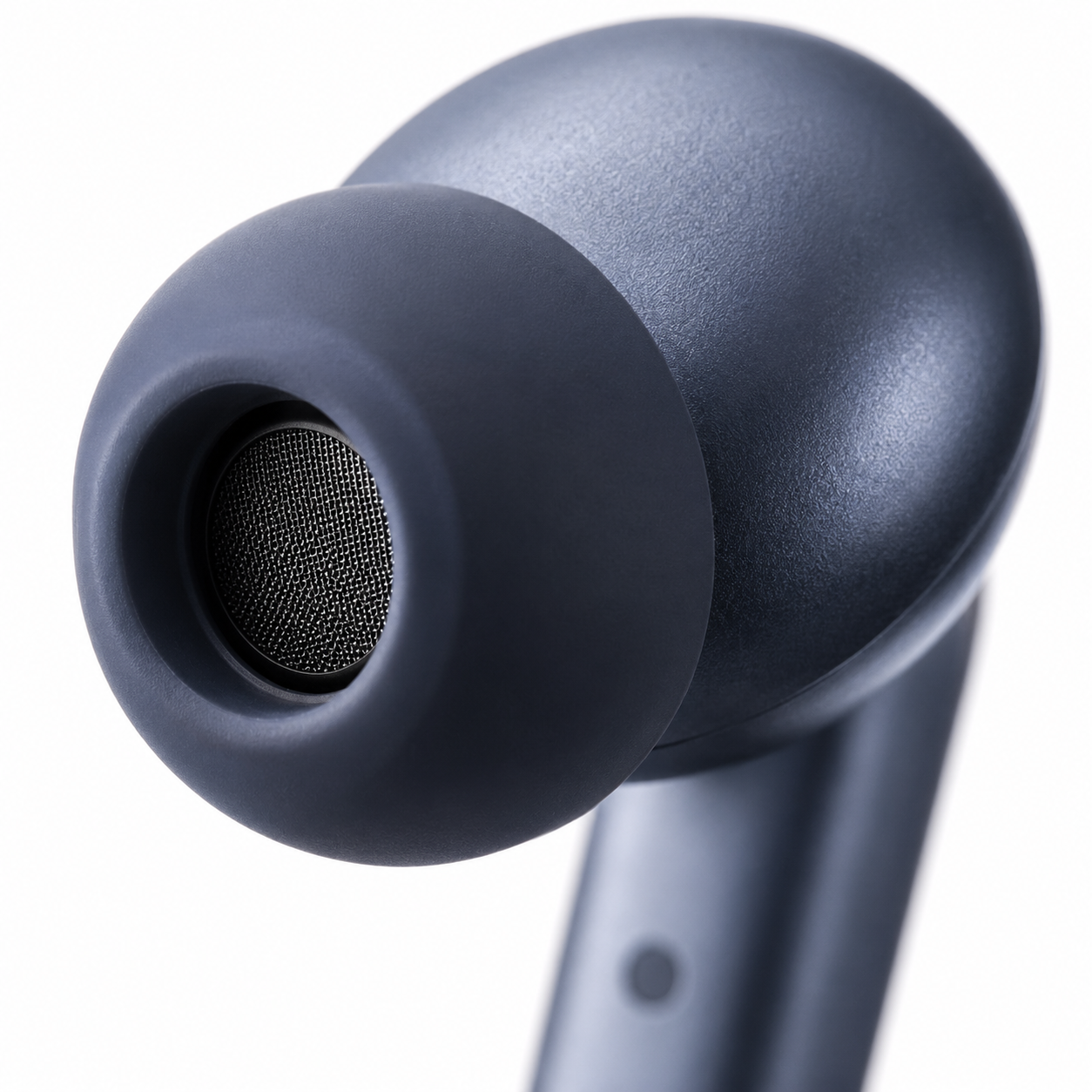 Extreme close-up of the boAt Airdopes Prime 700 ANC wireless earbud highlighting the soft silicone ear tip, precision speaker mesh, matte metallic blue finish, and ergonomic in-ear design
