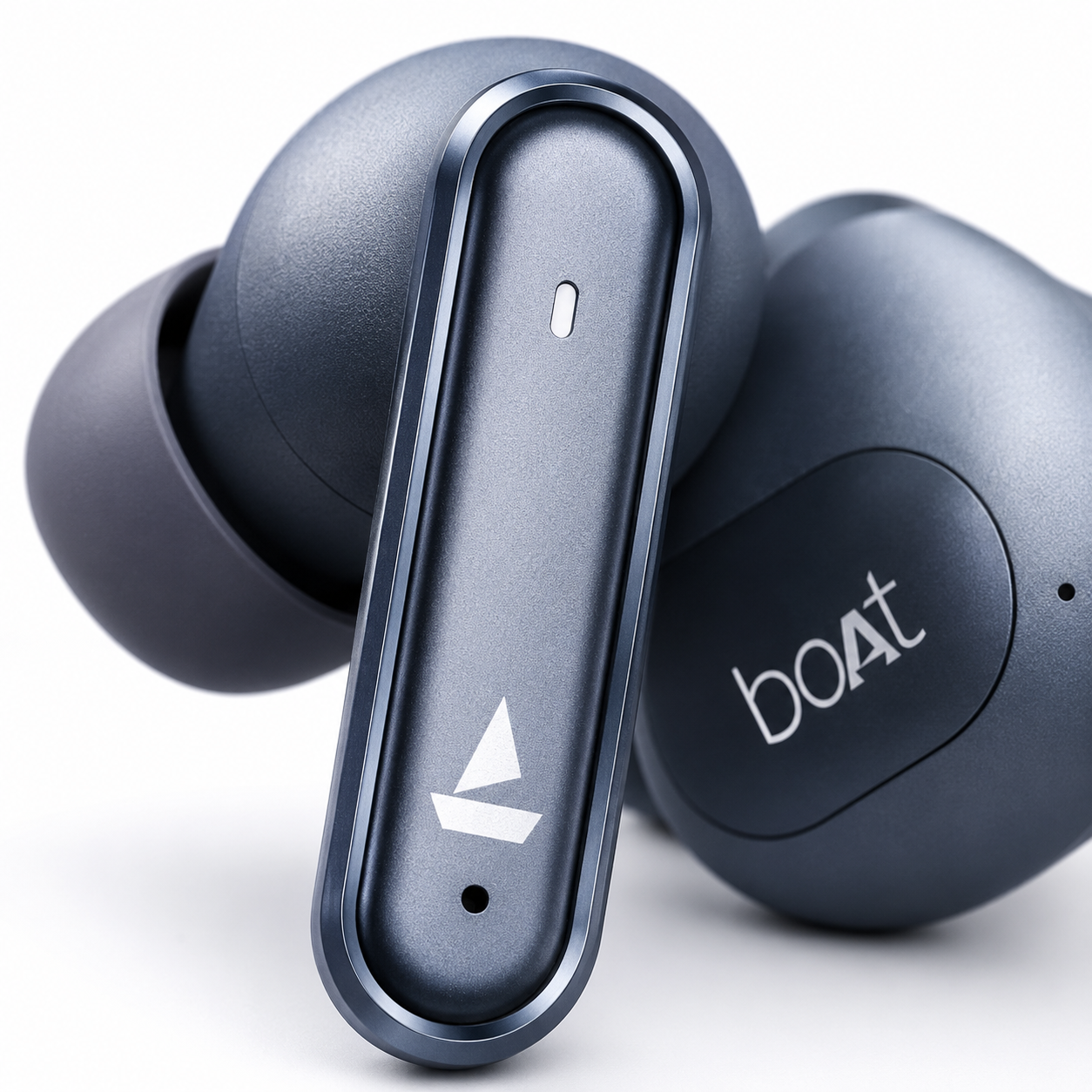 Extreme close-up of the boAt Airdopes Prime 700 ANC wireless earbud highlighting the soft silicone ear tip, precision speaker mesh, matte metallic blue finish, and ergonomic in-ear design