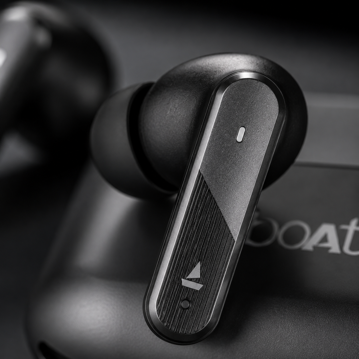 Macro close-up of a true wireless Bluetooth earbud showcasing textured touch control surface, ergonomic in-ear fit, and modern stem-style design for music, calls, and gaming.