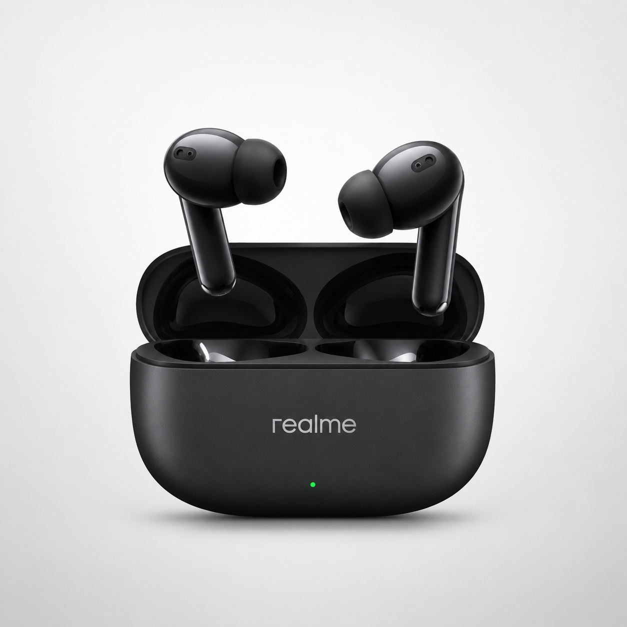 realme Buds T310 true wireless earbuds displayed above an open charging case, featuring an in-ear design, silicone ear tips, built-in microphones, and a compact matte black charging case