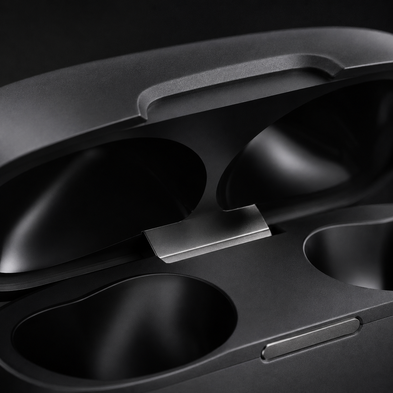 Macro close-up of wireless earbuds charging case hinge mechanism, showcasing premium build quality, smooth lid design, and durable construction details.