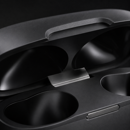 Macro close-up of wireless earbuds charging case hinge mechanism, showcasing premium build quality, smooth lid design, and durable construction details.